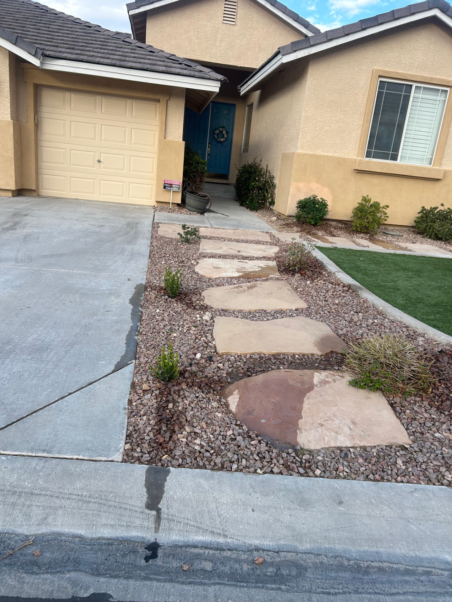 Flagstone stepping stone walkway set in decorative rock