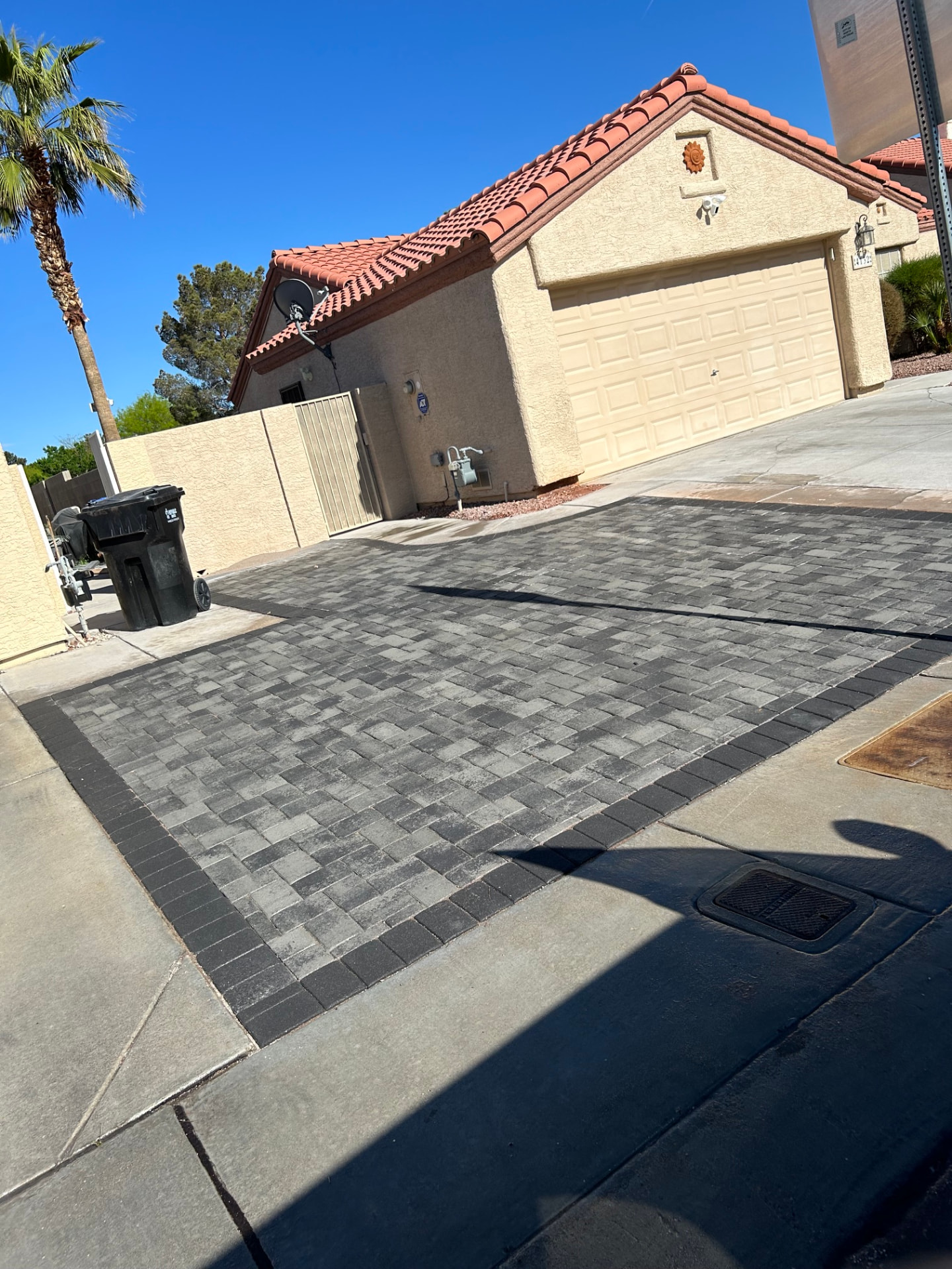 Herringbone paver driveway extension with charcoal border