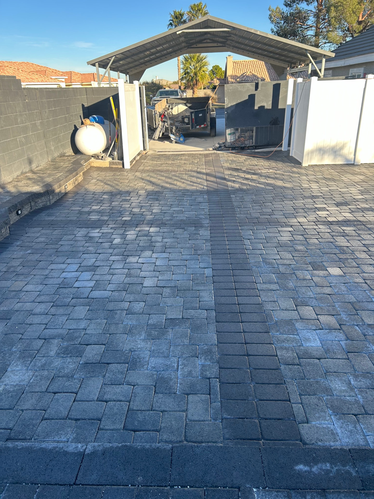 Paver side yard and gate access with herringbone pattern