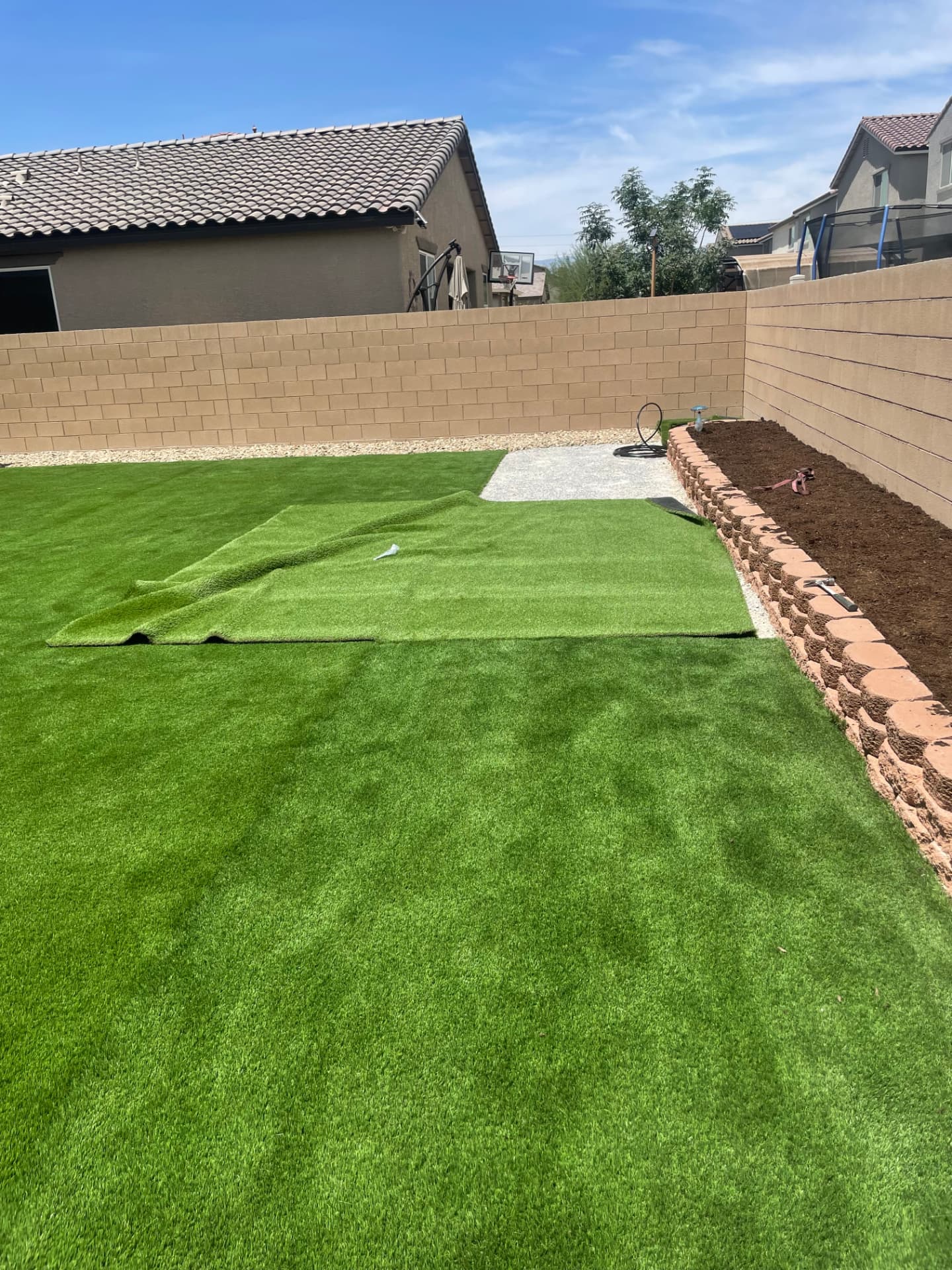 Artificial turf installation across a Las Vegas backyard